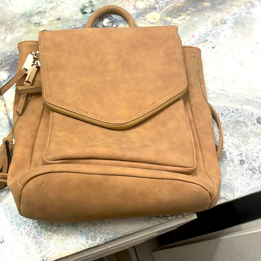 Light brown leather backpack